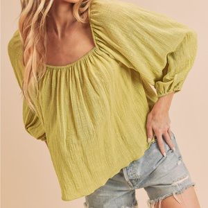 Chic blouse that can be super cute in the summer or even at a beach vacay.